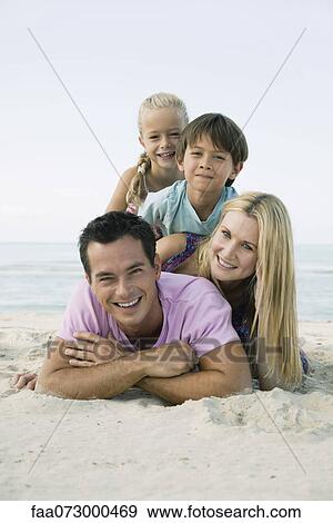 Family posing together at the beach, portrait View Large Photo Image Stock Photo - Family posing together at the beach, portrait. Fotosearch
