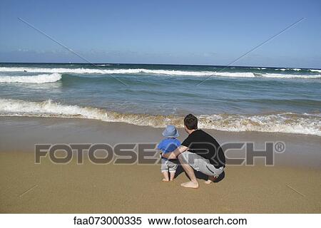 Father and baby at the beach, looking at sea View Large Photo Image Stock Photography - Father and baby at the beach, looking at sea. Fotosearch