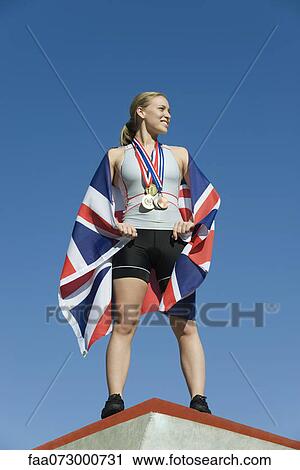 Female athlete being honored on podium View Large Photo Image Stock Image - Female athlete being honored on podium. Fotosearch