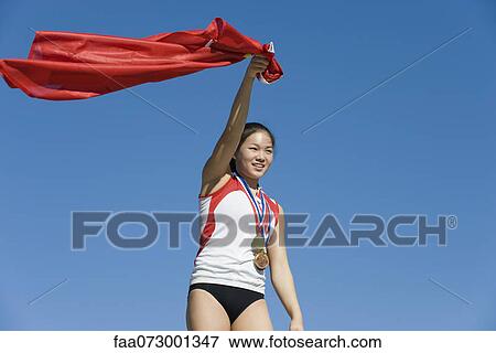 Female athlete being honored on podium View Large Photo Image Stock Photo - Female athlete being honored on podium. Fotosearch