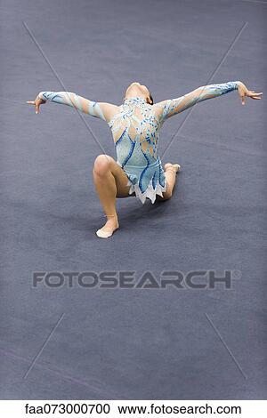 Female gymnast performing floor routine View Large Photo Image Stock Image - Female gymnast performing floor routine. Fotosearch