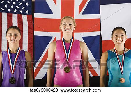 Stock Image - Female gymnastic medalists, portrait. Fotosearch