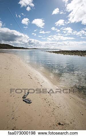 Flipflops left on beach View Large Photo Image Stock Photo - Flipflops left on beach. Fotosearch