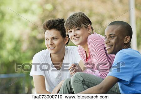 Friends hanging out together View Large Photo Image Stock Image - Friends hanging out together. Fotosearch