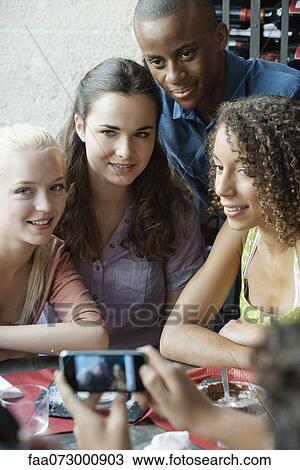 Friends having picture taken View Large Photo Image Stock Image - Friends having picture taken. Fotosearch