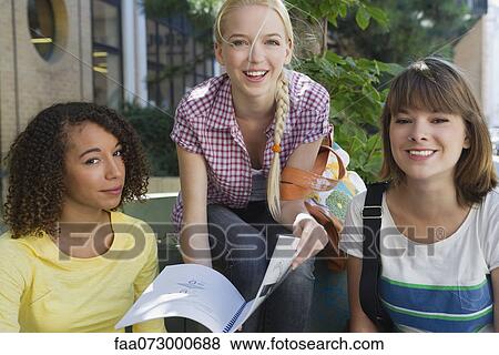 Friends studying together outdoors View Large Photo Image Stock Photo - Friends studying together outdoors. Fotosearch