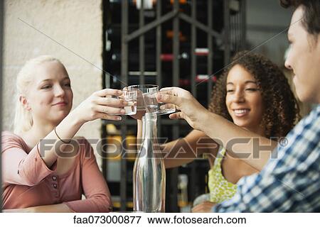 Stock Photo - Friends toasting. Fotosearch
