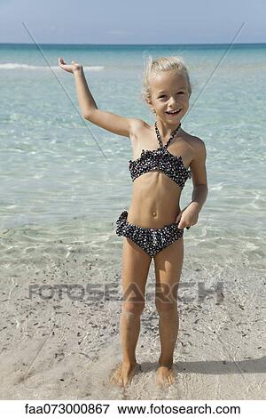 Stock Photo - Girl at the beach. Fotosearch
