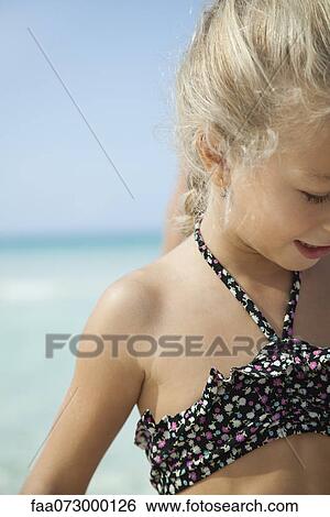 Stock Photograph - Girl at the beach. Fotosearch