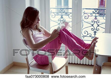 Stock Photo - Girl reading book. Fotosearch