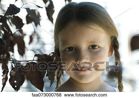 Stock Photo - Girl smiling, portrait. Fotosearch