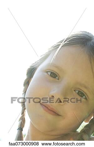 Stock Photo - Girl smiling, portrait. Fotosearch
