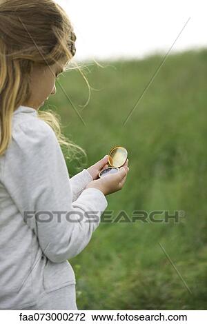 Girl using compass View Large Photo Image Stock Image - Girl using compass. Fotosearch