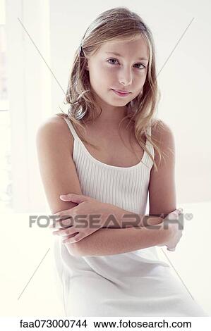 Picture - Girl with arms folded, portrait. Fotosearch