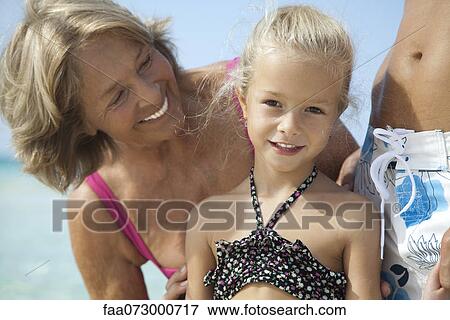 Grandmother and granddaughter at the beach View Large Photo Image Stock Photo - Grandmother and granddaughter at the beach. Fotosearch