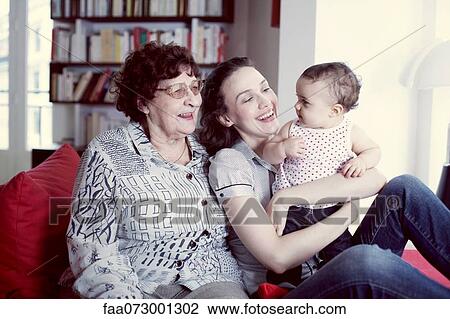 Stock Image - Grandmother, mother and baby girl, portrait. Fotosearch