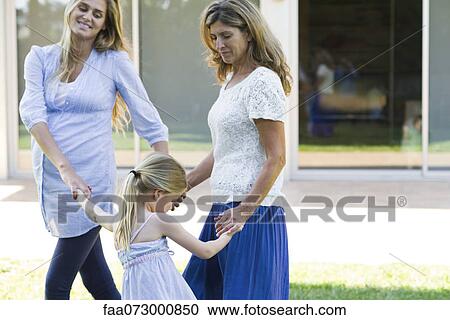 Grandmother, mother and daughter holding hands View Large Photo Image Stock Image - Grandmother, mother and daughter holding hands. Fotosearch
