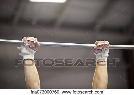 Gymnast gripping horizontal bar, cropped View Large Photo Image Stock Image - Gymnast gripping horizontal bar, cropped. Fotosearch