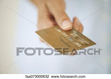 Hand holding credit card, cropped View Large Photo Image Stock Image - Hand holding credit card, cropped. Fotosearch