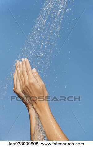 Hands under splashing water View Large Photo Image Stock Photography - Hands under splashing water. Fotosearch