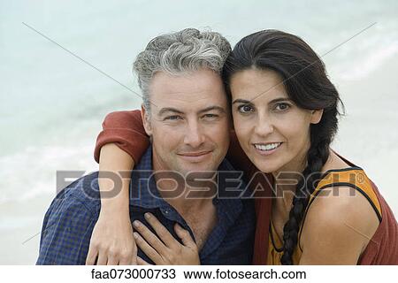 Husband and wife embracing, portrait View Large Photo Image Stock Image - Husband and wife embracing, portrait. Fotosearch
