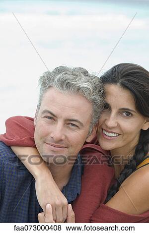 Husband and wife embracing, portrait View Large Photo Image Stock Photo - Husband and wife embracing, portrait. Fotosearch