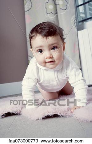 Infant crawling on floor, portrait View Large Photo Image Stock Photo - Infant crawling on floor, portrait. Fotosearch