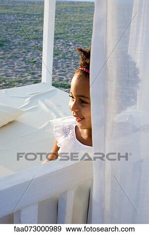 Little girl in curtained gazebo View Large Photo Image Stock Photo - Little girl in curtained gazebo. Fotosearch