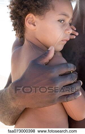 Stock Photo - Little girl in her father's arms, cropped. Fotosearch