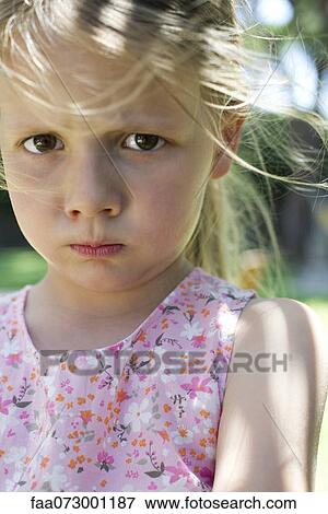 Stock Photo - Little girl pulling face. Fotosearch