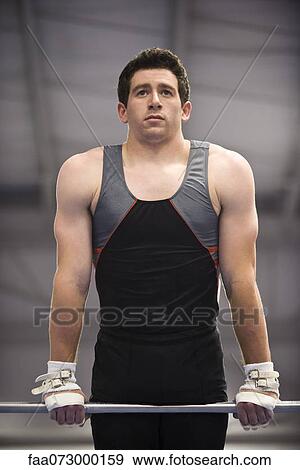 Stock Photo - Male gymnast on horizontal bar. Fotosearch