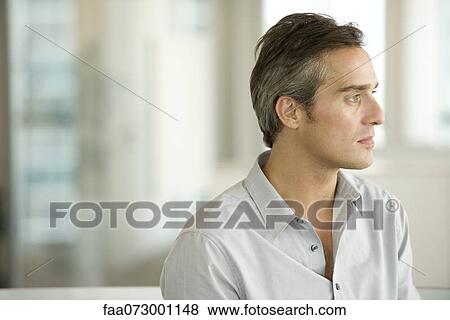 Man looking away in thought, portrait View Large Photo Image Stock Photo - Man looking away in thought, portrait. Fotosearch
