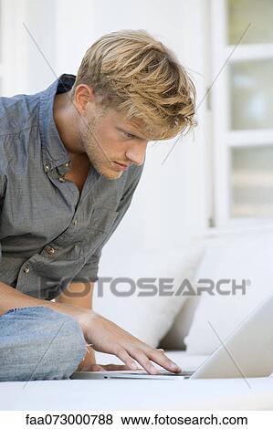 Man using laptop computer View Large Photo Image Stock Photo - Man using laptop computer. Fotosearch