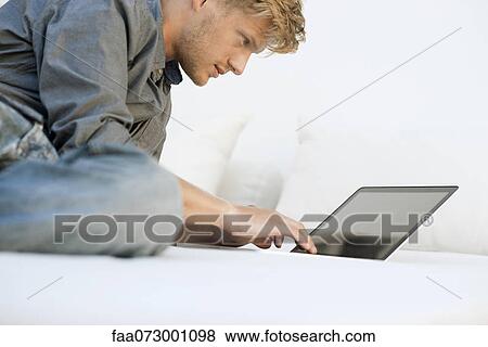 Man using laptop computer View Large Photo Image Stock Photo - Man using laptop computer. Fotosearch