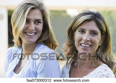 Mother and grown-up daughter, portrait View Large Photo Image Stock Image - Mother and grown-up daughter, portrait. Fotosearch