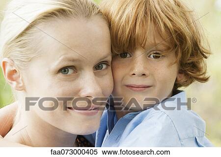 Mother and young son embracing, portrait View Large Photo Image Stock Photography - Mother and young son embracing, portrait. Fotosearch