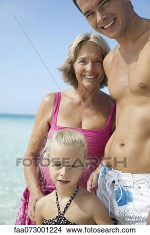 Multi-generation family at the beach View Large Photo Image Picture - Multi-generation family at the beach. Fotosearch