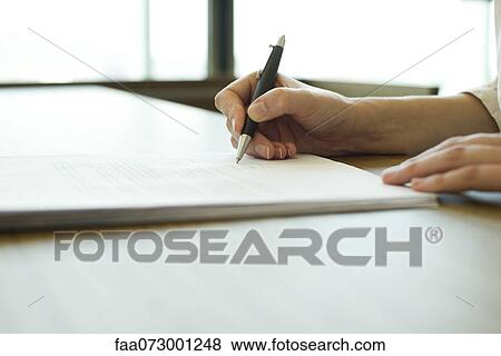 Person signing document, cropped View Large Photo Image Stock Photo - Person signing document, cropped. Fotosearch
