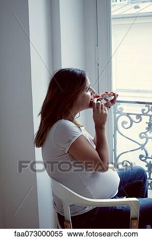 Pregnant woman eating toast with jam View Large Photo Image Stock Photography - Pregnant woman eating toast with jam. Fotosearch