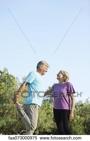 Senior couple stretching together outdoors View Large Photo Image Stock Photography - Senior couple stretching together outdoors. Fotosearch