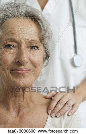 Senior woman with caring doctor, cropped View Large Photo Image Stock Image - Senior woman with caring doctor, cropped. Fotosearch