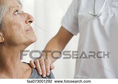 Senior woman with caring doctor, cropped View Large Photo Image Stock Image - Senior woman with caring doctor, cropped. Fotosearch