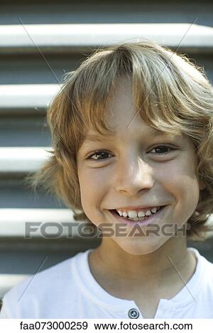 Stock Photo - Smiling boy, portrait. Fotosearch