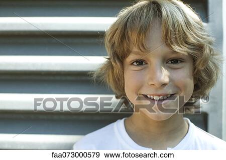 Stock Photo - Smiling boy, portrait. Fotosearch