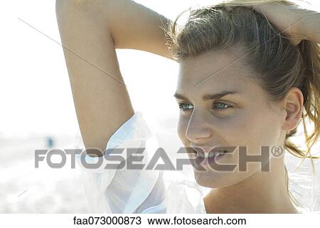 Smiling woman with hands in hair View Large Photo Image Stock Image - Smiling woman with hands in hair. Fotosearch