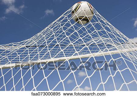 Stock Photography - Soccer ball hitting net. Fotosearch