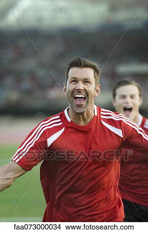 Soccer players shouting in victory View Large Photo Image Picture - Soccer players shouting in victory. Fotosearch