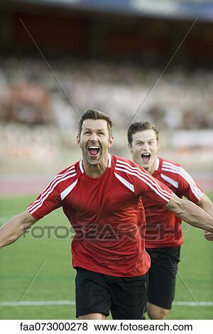 Soccer players shouting in victory View Large Photo Image Stock Photo - Soccer players shouting in victory. Fotosearch