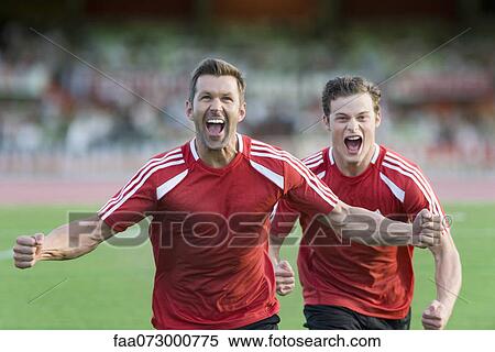 Stock Photography - Soccer players shouting in victory. Fotosearch