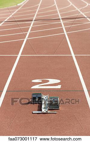 Starting block on running track View Large Photo Image Stock Photo - Starting block on running track. Fotosearch
